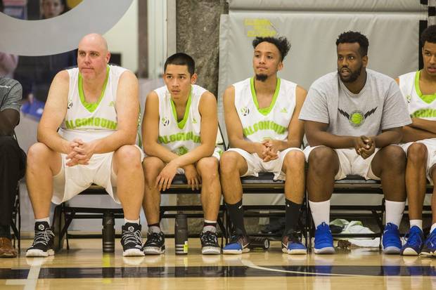 Thunder 38 year old rookie Dan Stoddart sits on a the bench as his team plays against the Centennial Colts during their OCAA basketball game in Toronto,