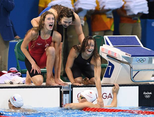 Canada's Taylor Ruck, left to right, Brittany MacLean, Katerine Savard and Penny Oleksiak take bronze in the women's 4 x 200m freestyle relay during the 2016 Olympic Summer Games in Rio de Janeiro, Brazil in Wednesday, Aug. 10, 2016.