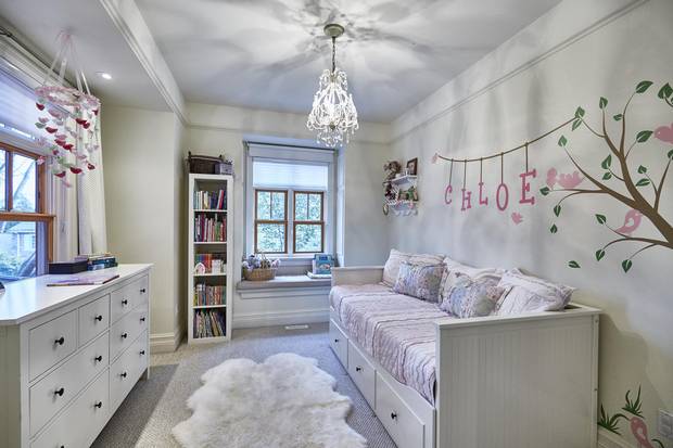 The couple cherishes many details of the home, including the window seat in their daughter's bedroom.