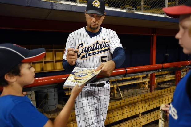 Quebec Capitales player Yuniesky Gurriel signs autographs for young fans after a game against the Garden State Grays. Four Cuban baseball players were legally allowed to leave the country to play baseball in Canada for the Quebec Capitales. This is a new venture for Cuba which is now only beginning to see a thaw in it's relationship with the United States.