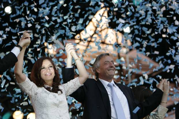 Argentina’s newly elected president Cristina Fernandez de Kirchner, left, and her husband, outgoing president Nestor Kirchner, raise their arms during a music festival in front of the presidential palace in Buenos Aires after she was sworn in Dec. 10, 2007. Ms. Fernandez de Kirchner left the presidency in 2013.