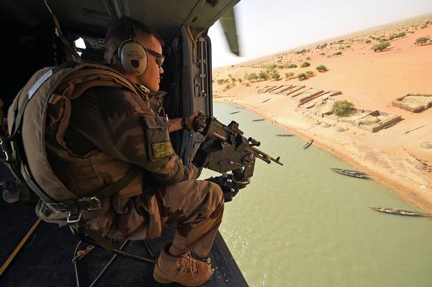 A French soldier patrols during a tactical flight on March 12 over Mali.