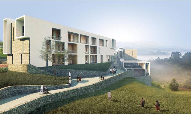 View of the Munini District Hospital's public pedestrian access between blocks Y and Z with Auditorium overlooking farmland below.