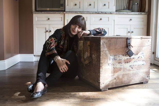 Jeanne Beker sits beside the trunk her parents brought with them to Canada when they arrived at Halifax’s Pier 21 in 1948. The trunk and its contents will become part of the permanent collection at the Museum of Immigration in Halifax.