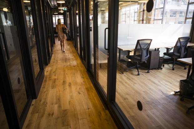 While unbuttoned, the work environment at WeWork’s Toronto facility on Richmond Street West retains a professional aura. Tenant businesses pay membership dues and the amenities, in part, aim to impress investors and clients to show how serious their enterprises are.