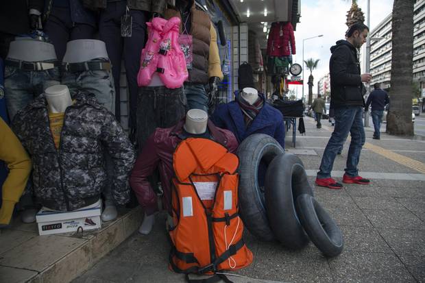 A clothes shop in Izmir sells life jackets for refugees.