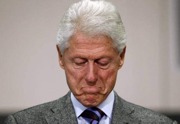 Former U.S. president Bill Clinton pauses while speaking at a campaign stop for his wife, Democratic presidential candidate Hillary Clinton, on Feb. 16, 2016, in Greenville, S.C.