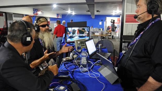 David Bossie, President of Citizens United, and Phil Robertson, of Duck Commander, talk with Stephen K. Bannon while appearing on Brietbart News Daily on SiriusXM Patriot at Quicken Loans Arena on July 21, 2016 in Cleveland, Ohio.