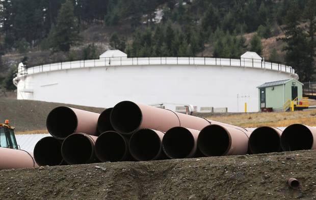 Replacement pipe is stored near crude oil storage tanks at Kinder Morgan’s Trans Mountain Pipeline terminal in Kamloops, B.C.