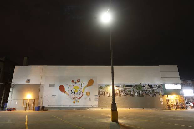 Puppy love by Gabrielle Funk and Takashi Iwasaki was painted on grocery store in the West End neighbourhood.