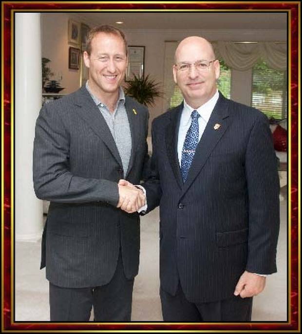 Mr. Goodwin shakes hands with Peter MacKay, then the federal defence minister, in Surrey, B.C., on July 15, 2012.