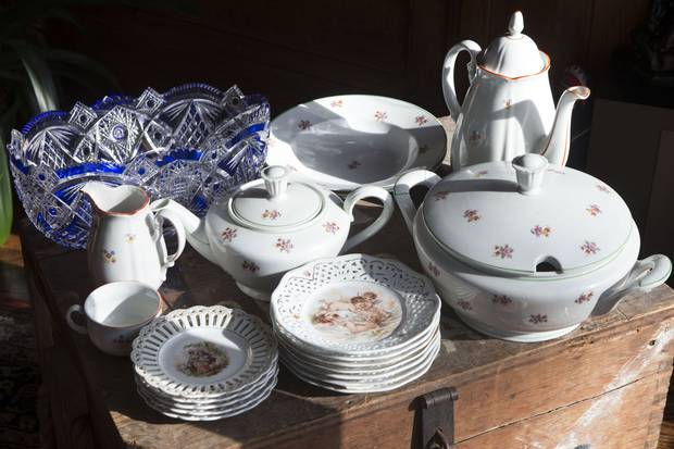 The Beker family brought over their German china, porcelain plates and a blue crystal bowl, left, in the trunk.