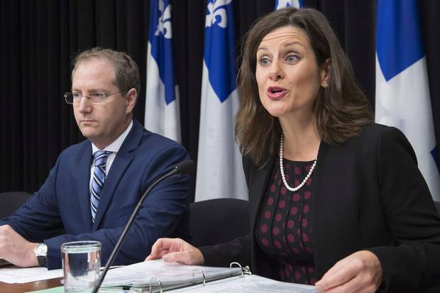 Oct. 24, 2017: Quebec Justice Minister Stephanie Vallée, right, provides further details about how the government's controversial Bill 62 at a Quebec City news conference.