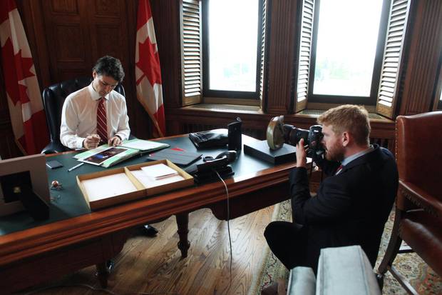 The Prime Minister goes about his business apparently oblivious to the snapping of Adam Scotti, which he says he tunes out – unless there is something he can do to make a shot better.
