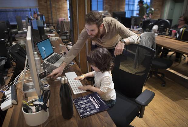 Jason Goldlist and his three-year-old son Abe are photographed in the offices of Wealthsimple on Nov. 14, 2017.