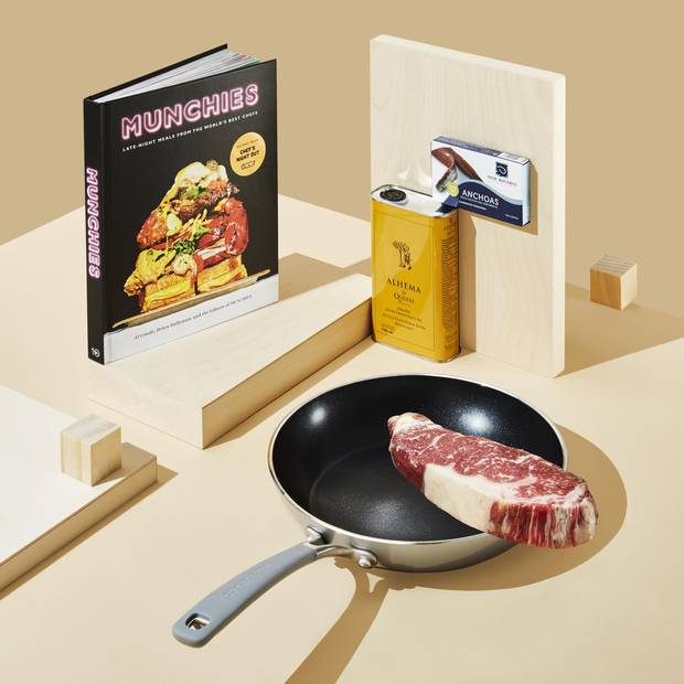 Pictured: Munchies: Late Night Meals form the World’s Best Chefs, $40 at Indigo; Alhema olive oil, $16 at Pasquale Brothers; Don Bocarte achovy fillets in extra virgin olive oil, $16.99; Ribeye steack, price on request at Cumbrae’s; KitchenAid frying pan, $79.99 at Hudson’s Bay 