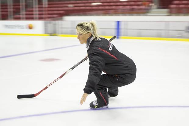 Dawn Braid, a member of the coaching staff with NHL's Arizona Coyotes demonstrates a power push for puck protection following a training session with a hockey player in Toronto on Tuesday August 30 2016.