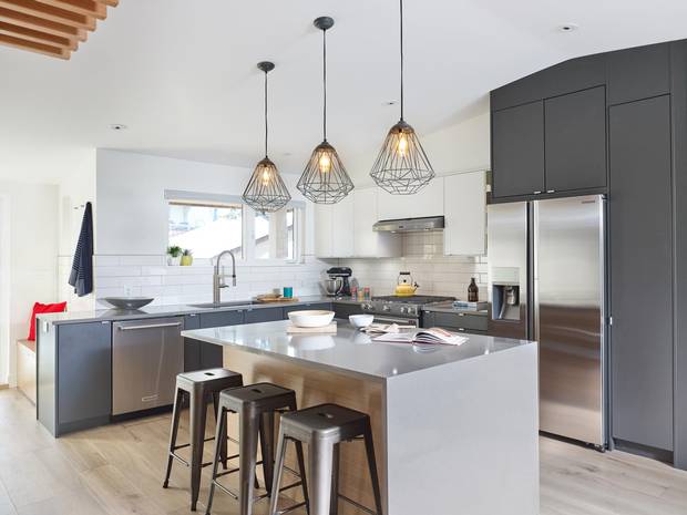 The lower level, where Maya’s parents live, has a living area with a 12-foot-high ceiling and a huge gourmet kitchen.