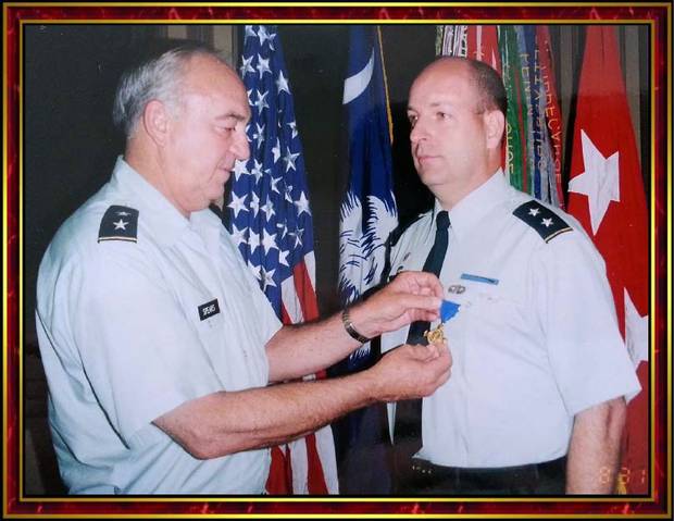 Robert E. Lee Goodwin III, right, is awarded the Palmetto Cross.