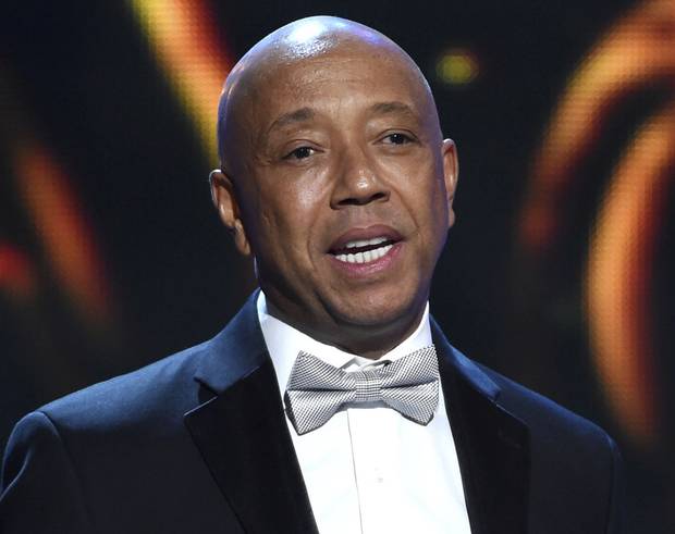 In this Feb. 6, 2015, file photo, Russell Simmons presents at the 46th NAACP Image Awards in Pasadena, Calif.