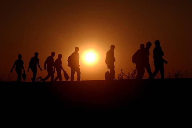 Syrian refugees and migrants along a railway line as they try to cross from Serbia into Hungary near Horgos on Sept. 1, 2015.