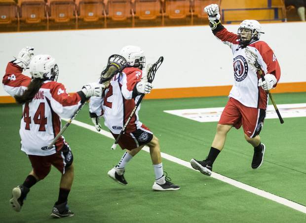 Team Ontario's Shkuhnodin Shognash-Myers celerbrates her goal with teammates against Team BC during their under 19 women's lacrosse match.