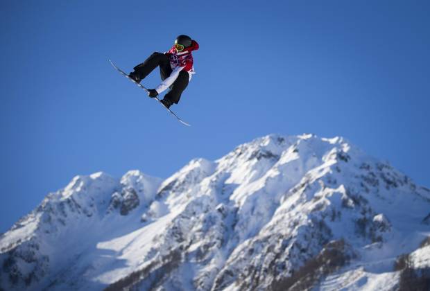 Canadian snowboarder Mark McMorris sails through the air the slopestyle event at the Rosa Khutor Exterme Park February 8, 2014 during the Sochi Winter Olympics.