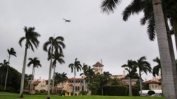 An airplane on approach to the West Palm Beach airport flies over the Mar-a-Lago estate in Palm Beach, Fla., where U.S. president-elect Donald Trump is staying.