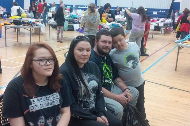 Jeff Cheecham and his fiancee Crystal Powder evacuated from Anzac with their daughter Cyndel, son Cyrus and pets Wednesday night. They collected donated goods at the evacuation centre in Lac La Biche. They are pictured at the evacuation centre in Lac La Biche Thursday, May 5, 2016. Carrie Tait/The Globe and Mail