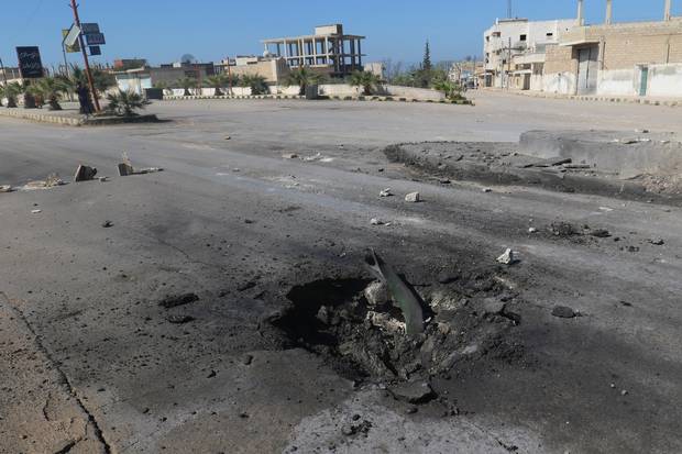 A crater is seen at the site of an airstrike, after what rescue workers described as a suspected gas attack in the town of Khan Sheikhoun.
