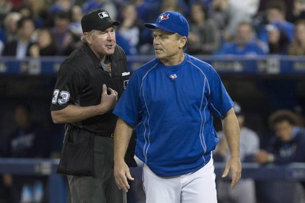 Toronto Blue Jays' Manager John Gibbons, right, has an exchange with home plate umpire Mike Winters after Jays' shortstop Troy Tulowitzki is struck out by Tampa Bay Rays' starting pitcher Drew Smyly during fourth inning Major League Baseball action in Toronto, Monday, May 16, 2016.