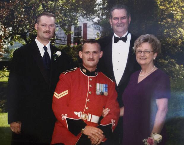 A family photo of (left to right) the late Sgt. Ron Anderson, his brother Ryan and parents Peter and Maureen. Sgt. Ron Anderson died by suicide in February, 2014. His brother Ryan is also a member of the military and being treated for PTSD.