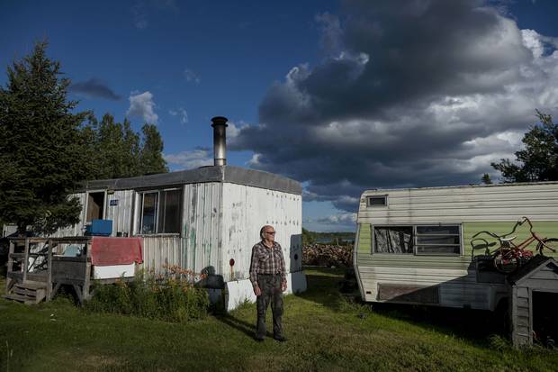 Jackie Vautour in front of his shack in Kouchibouguac National Park.