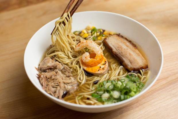 Praire Pork Bowl, with smoked pork bone broth, pork shoulder, roasted pork belly, umeboshi egg, chicharron, black garlic oil and sesame corn, at Prairie Noodle Shop.