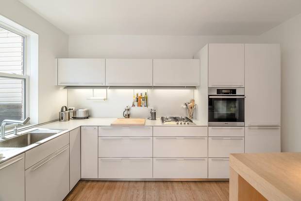 An east-facing window was added the kitchen and a half wall was torn down to bring in more light.