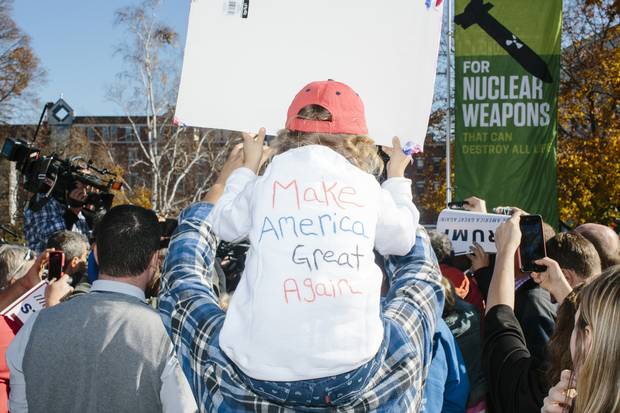 Trump supporters wait for his arrival outside at the New Hampshire State House to officially file his candidacy in the New Hampshire primary in Concord, N.H.