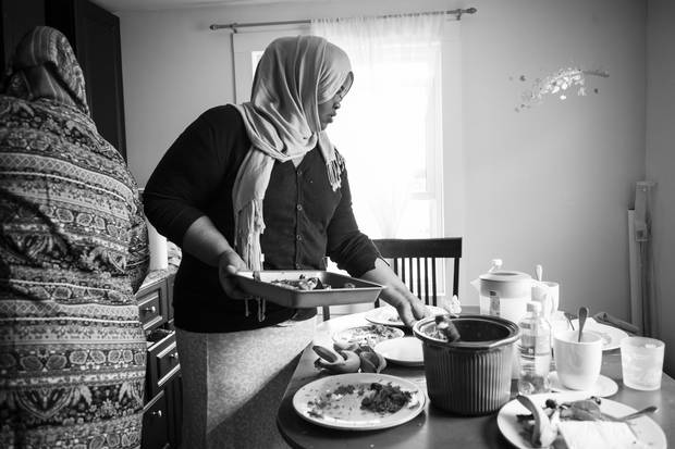 Refugee claimant Asha Ahmed came to Canada two months ago. She was once the acting minister for women’s rights for Puntland state in Somalia, before her life was threatened by al-Shabaab. She now lives in Winnipeg while she waits for her refugee claim hearing. Here, she cleans up after lunch in the apartment that she shares with other asylum seekers.
