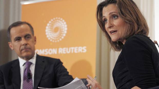 Bank of Canada Governor Mark Carney (L) is interviewed by Chrystia Freeland, Thomson Reuters Managing Director and Editor, Consumer News, at the National Press Club in Washington April 18, 2013.