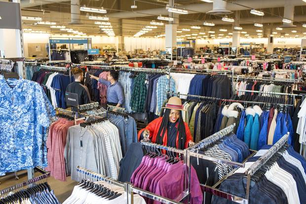 Workers prepare for the opening of the Nordstrom Rack store in Vaughan Mills, Ont., on Thursday. The site is one of six Canadian stores the company aims to open in 2018.