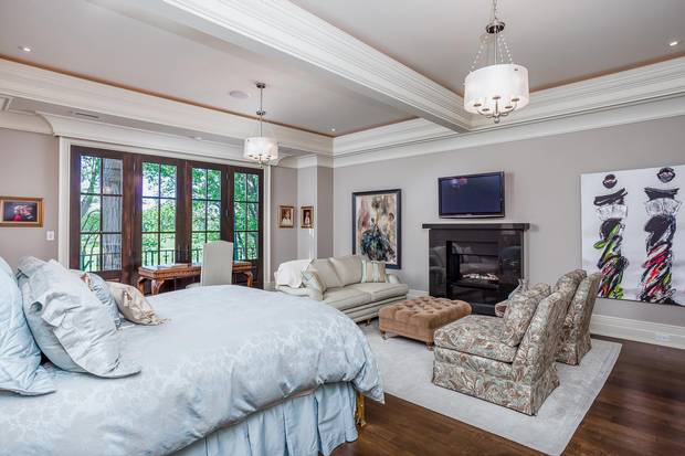 The master bedroom features a sitting area and television.
