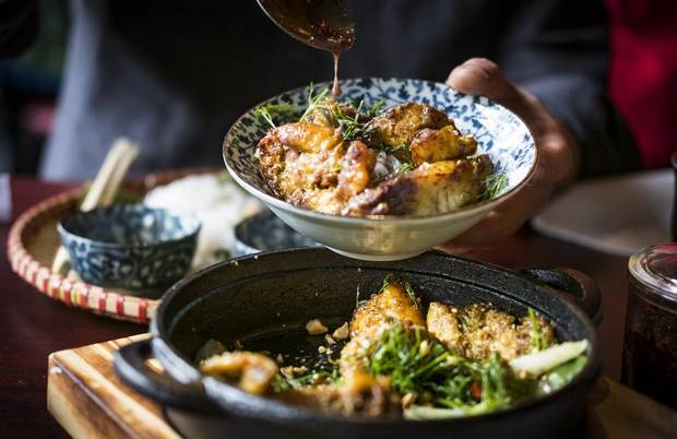 Sizzling turmeric fish at Mr. Red Cafe in Vancouver.