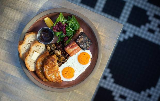 Full breakfast with eggs, duck sausage, pork & beans, boudin noir, rosti and toast.