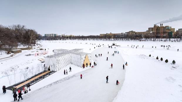 Skaters pass by RAW:almond near The Forks in Winnipeg.