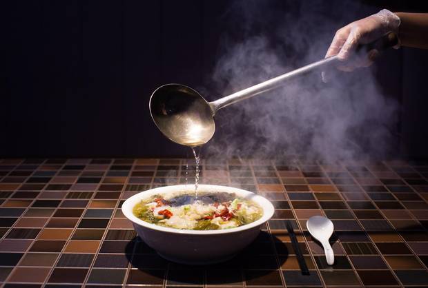 The menu at Nine Dishes in Richmond roams across China; highly recommended is the pickle fish soup, seen above, a mix sour and spicy flavours.