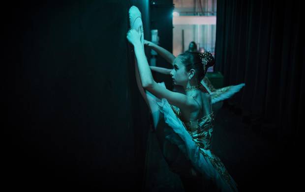 Dancers warm up back stage.