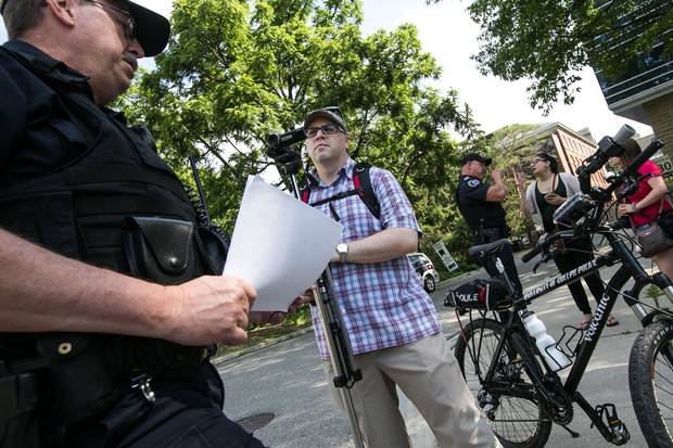 Adam Donaldson, the one-man staff of Guelph Politico, covers a police news conference and demonstration at the University of Guelph. He has launched a crowdfunding campaign on Patreon to support his work on the blog full-time.