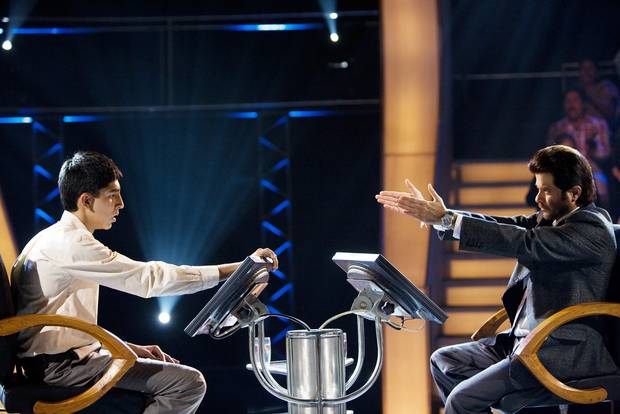 Dev Patel, left, and Anil Kapoor in a scene from Slumdog Millionaire, the best picture winner in 2009 and a People's Choice Award winner at TIFF.