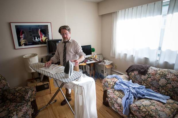 Ian Martin is pictured in his rental apartment in Vancouver.