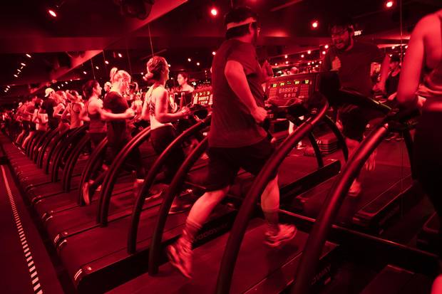 Cliff Lee takes a run at treadmill intervals in a Barry's Bootcamp class.