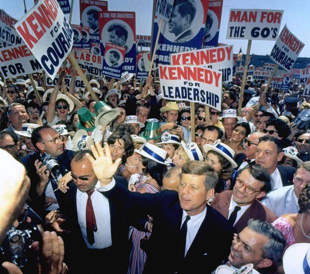 Sen. John F. Kennedy makes his way through a crowd of supporters and journalists as he arrives in Los Angeles, July 9, 1960 for the Democratic National Convention.